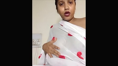 Aunty revealing her breasts in a sheer white saree